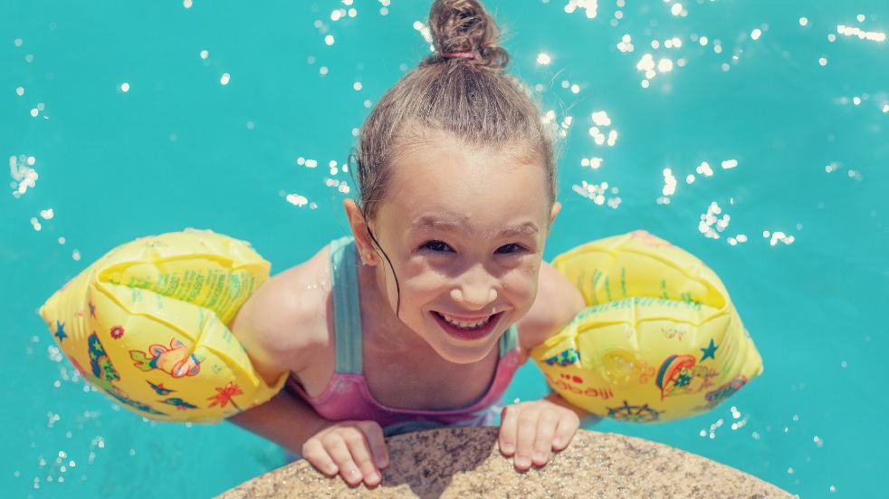 Little girl in swimming pool